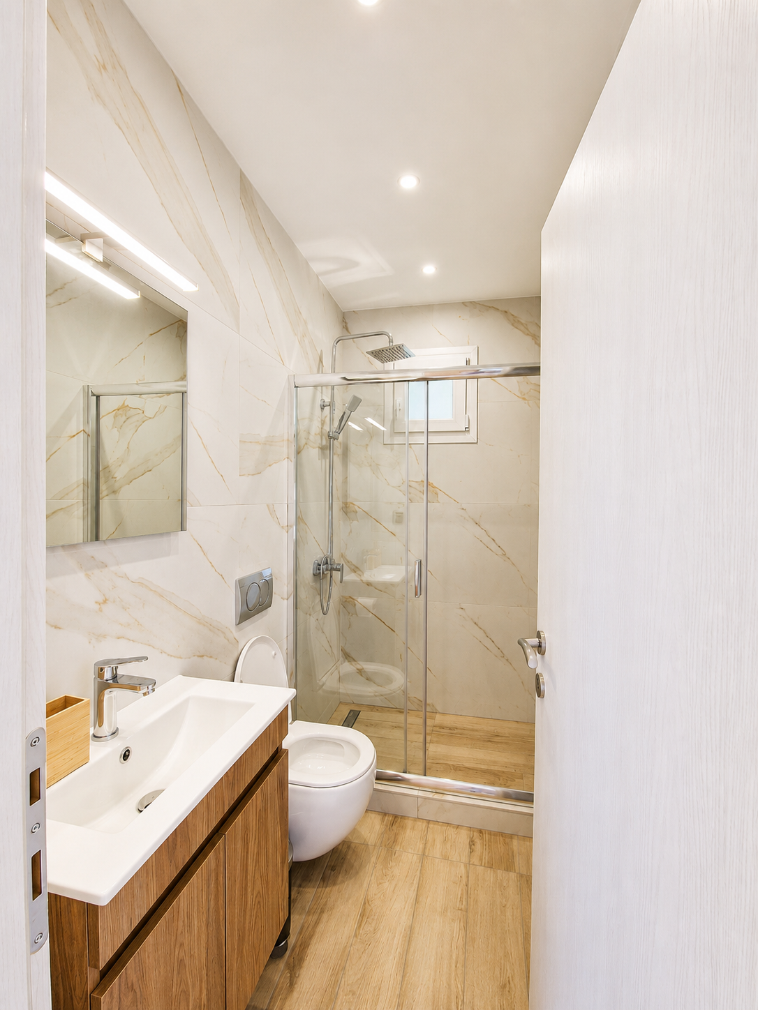 Bathroom with marble walls and timber vanity
