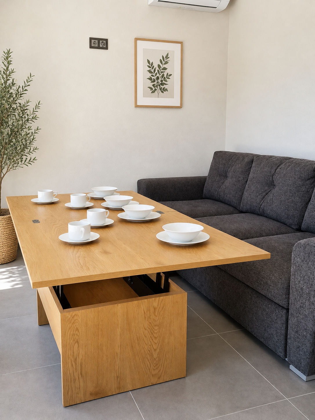 Sofa and dining table in the studio living area with botanical print